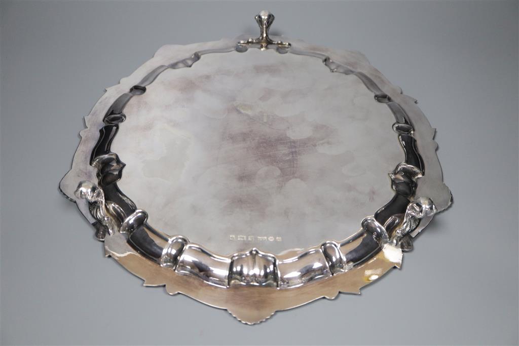 A modern circular silver salver with shell and scroll border on claw and ball feet, Birmingham, 1967, 30.3cm,